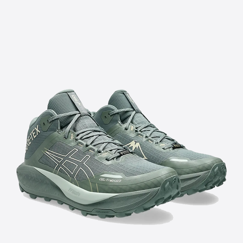 Asics Gel Trabuco 13 MT GTX trail running shoes in sage green with GORE-TEX upper and durable lugged outsole, front angle view.