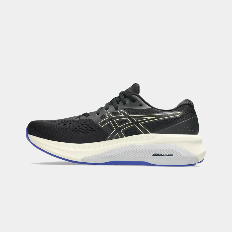 Asics GT-4000 4 running shoes in black with yellow accents, mesh upper, and white midsole, side view.