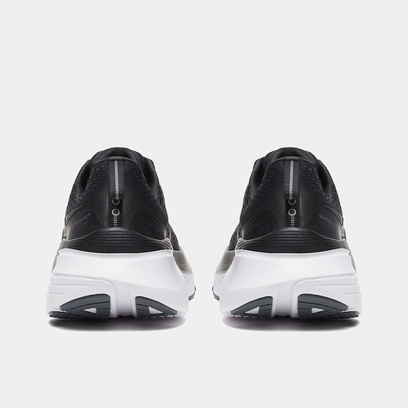 Saucony Guide 18 running shoes in black with white midsoles and reflective heel details, back view.
