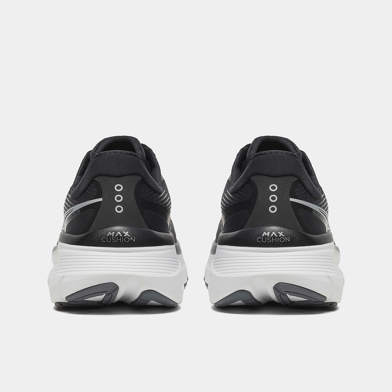 Saucony Guide 19 running shoes in black with white midsoles and MAX Cushion branding, back view showing heel design and outsole details.