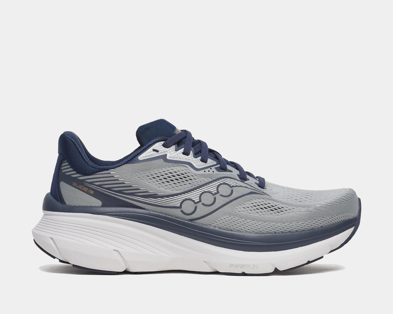 Saucony Guide 19 running shoes in gray with navy accents, breathable mesh upper, and PWRRUN cushioning, side view.