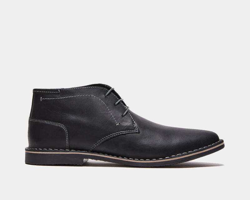 Steve Madden Harken chukka boots in black leather with stitched detailing and lace-up closure, side view.