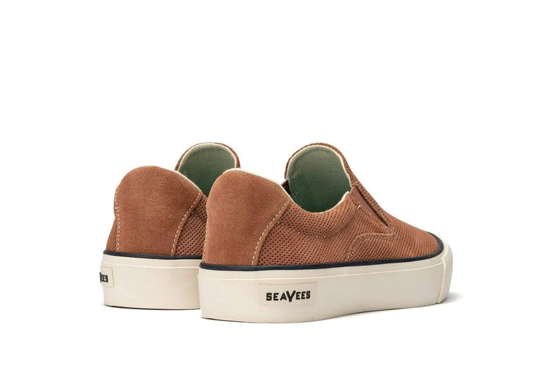 SeaVees Hawthorne Slip On shoes in brown suede with perforated detailing and white rubber sole, back view.