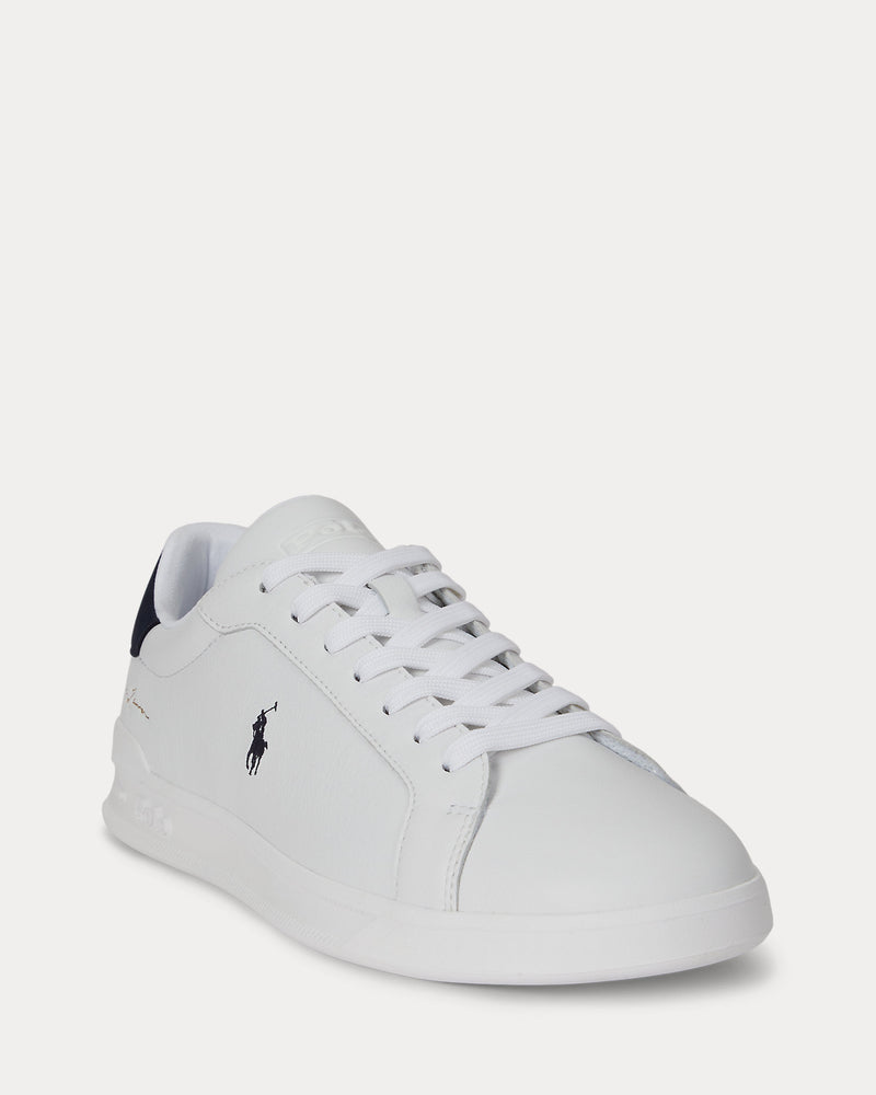 Polo Ralph Lauren Heritage Court II Leather sneakers in white with navy accents, featuring a leather upper, lace closure, and signature polo logo, angled front view.