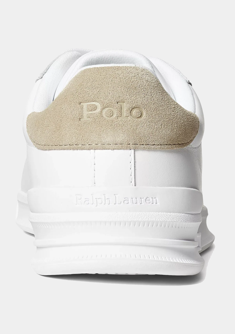 Polo Ralph Lauren Heritage Court II Leather sneakers, back view showing white leather upper, beige suede heel panel with embossed "Polo" logo, and textured midsole detailing.