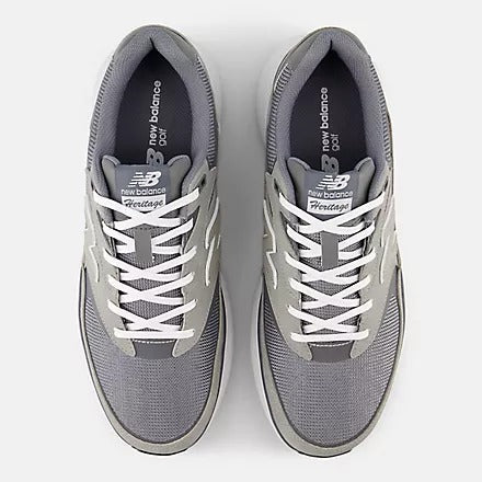 New Balance Golf Heritage Golf shoes in gray with mesh upper, white laces, and cushioned interior, top view.