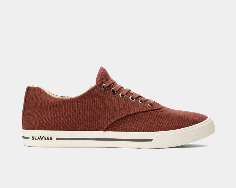 SeaVees Hermosa sneakers in rust-colored canvas with white rubber outsole and contrasting stripe detail, side view.