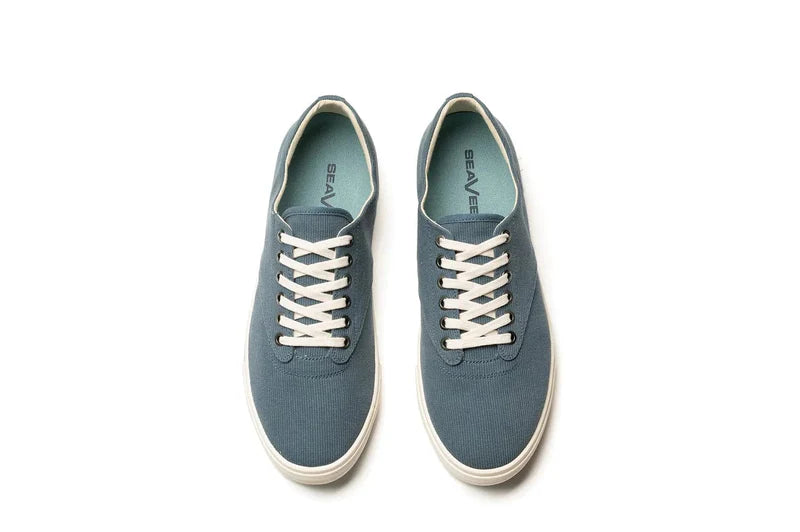 SeaVees Hermosa sneakers in blue canvas with white laces and a matching rubber sole, top view showing inner logo and lace design.