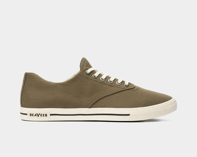 SeaVees Hermosa sneakers in olive green with textured canvas upper, white laces, and cream rubber sole, side view.