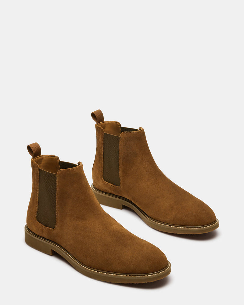 Steve Madden Highline Chelsea Boot in tan suede with elastic side panels and pull tabs, angled front-side view.