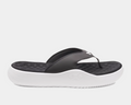Under Armour Ignite Pro 8 T sandals with black synthetic straps, cushioned black textured footbed, and white foam outsole, side view.