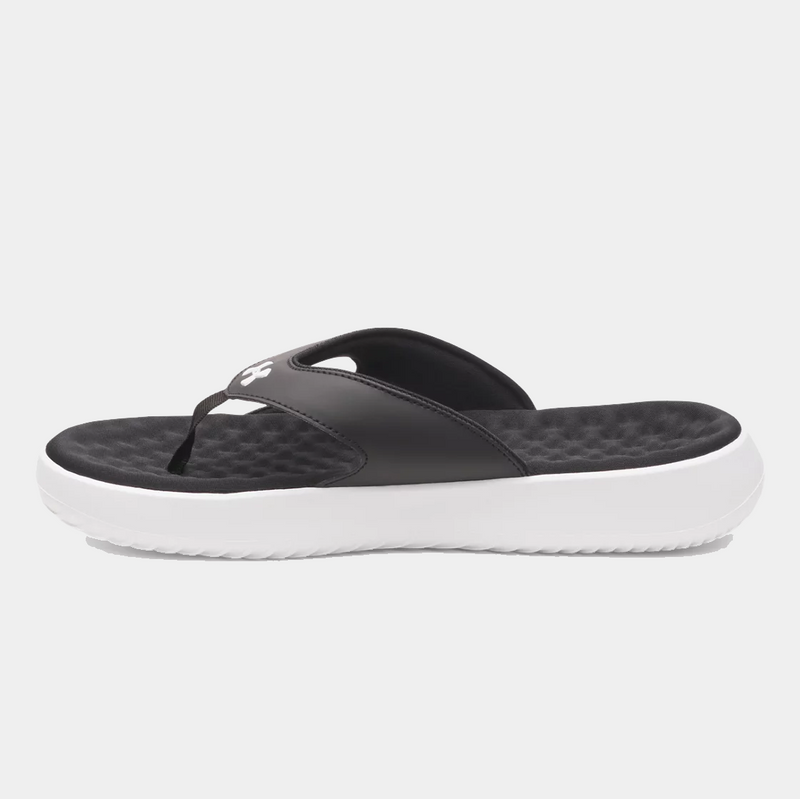 Under Armour Ignite Pro 8 T sandals in black with textured foam footbed and white sole, side view.