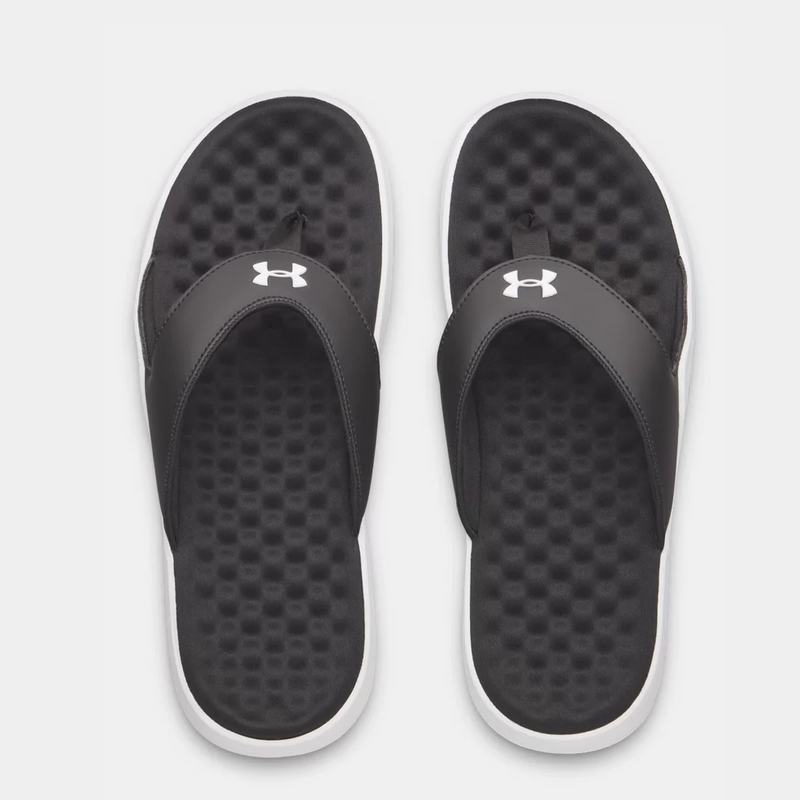 Under Armour Ignite Pro 8 T sandals with black synthetic straps, white logo, and textured foam footbed, top view.