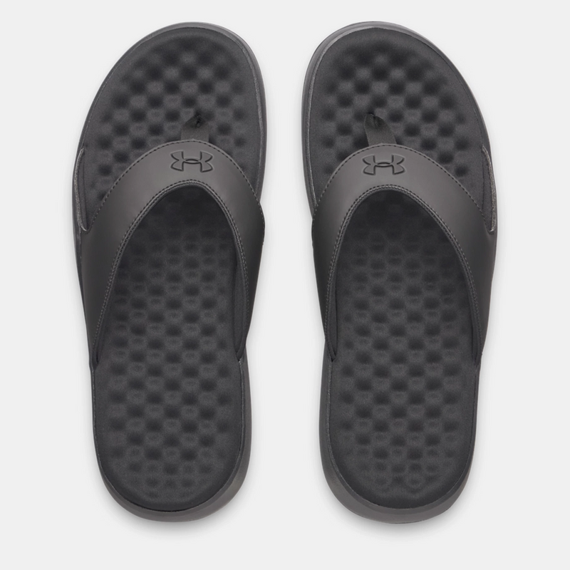 Under Armour Ignite Pro 8 T sandals in black with textured foam footbed and synthetic strap, top view.