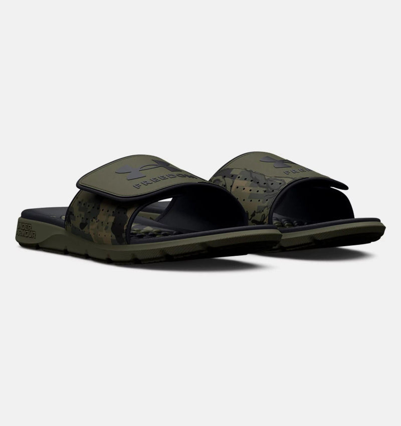Under Armour Ignite Pro Freedom Slides in green camouflage with adjustable strap and foam footbed, angled front view.