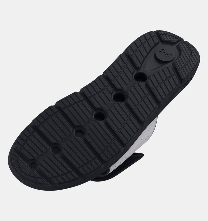Under Armour Ignite Pro SL shoes outsole with black rubber traction pattern and flex grooves, bottom view.
