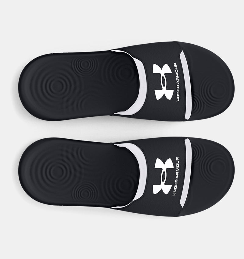 Under Armour Ignite Select slides in black with white strap accents and textured footbed, top view.