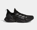 Adidas Impact FLX shoes in black with mesh upper, three-stripe detailing, and sculpted midsole, side view.