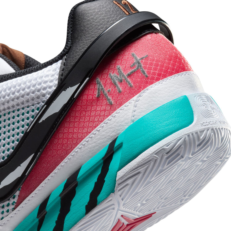 Nike Ja 1 "Scratch" basketball shoes, close-up of heel featuring red and teal color accents, scratch detailing, and textured outsole.