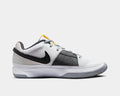 Nike Ja 1 "Wet Cement" basketball shoes in white and gray with black Swoosh logo, breathable mesh upper, and textured outsole, side view.