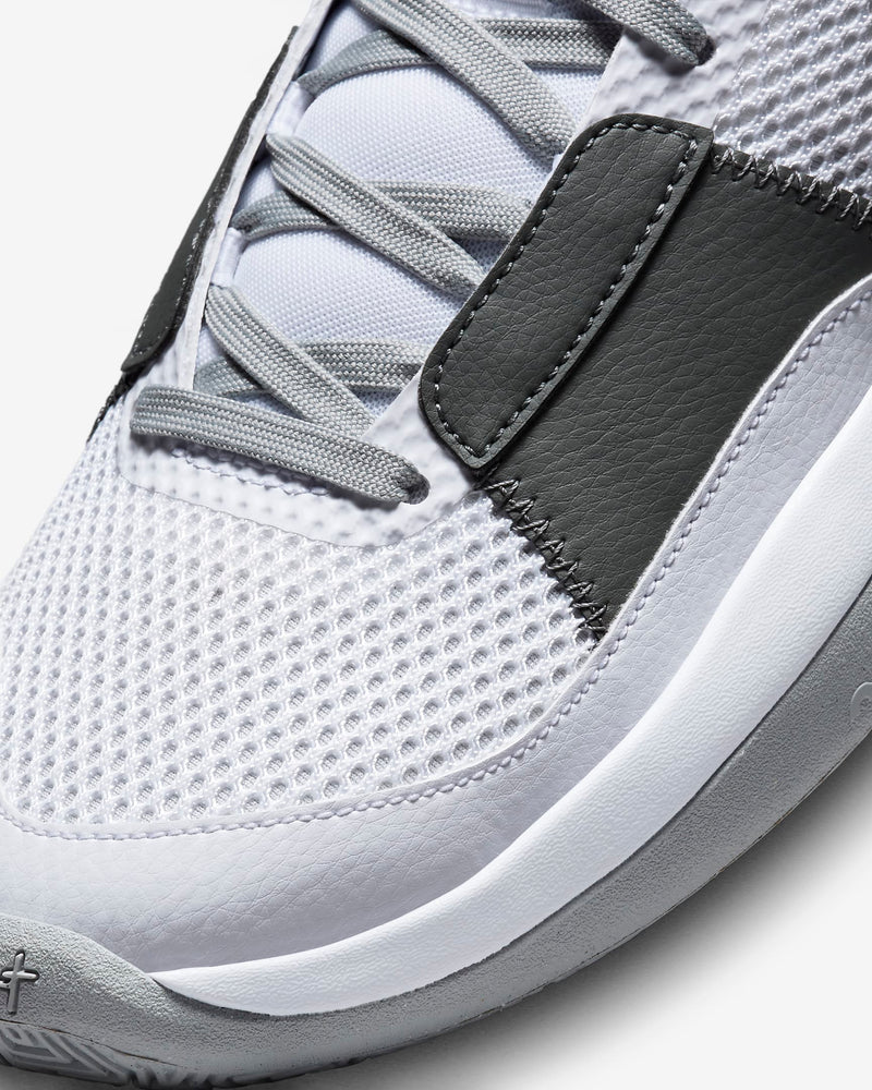 Nike Ja 1 "Wet Cement" basketball shoes close-up showing mesh upper, leather overlays, and gray laces.