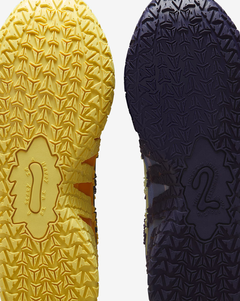 Nike Ja 3 "Channel 12" basketball shoes outsole featuring textured traction pattern in yellow and purple rubber, sole view.