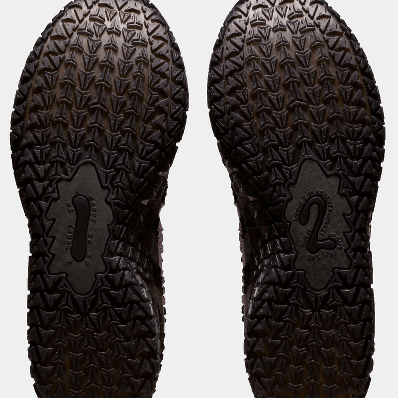 Nike Ja 3 "Mink Brown" shoe outsole featuring textured traction pattern and embossed design details, bottom view.