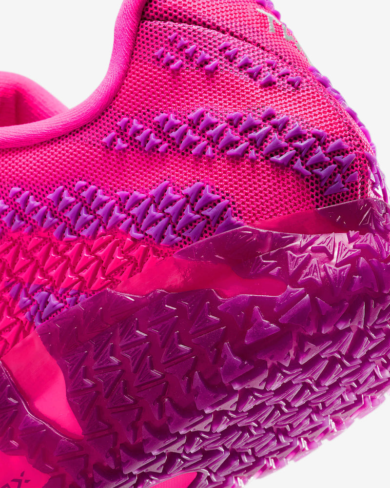 Nike Ja 3 "Price of Admission" basketball shoes with vibrant pink upper, textured purple overlays, and traction outsole, close-up view.