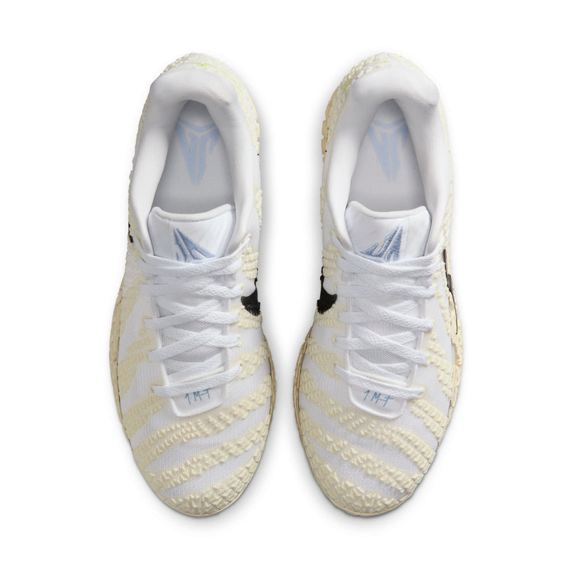 Nike Ja 3 "Sail" basketball shoes in white and cream with textured details and blue logo accents, top view.