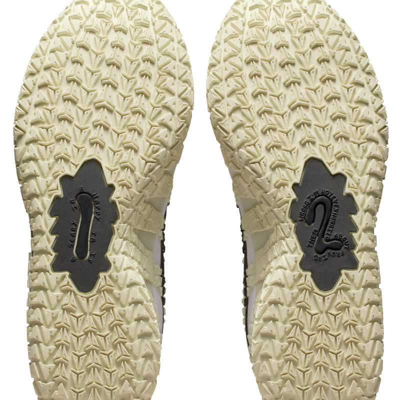 Nike Ja 3 "Sail" basketball shoes outsole with unique textured traction pattern in light beige rubber, bottom view.