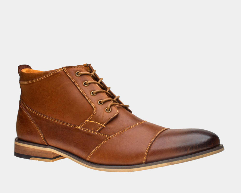 Steve Madden Jabbar boots in rich brown leather with cap toe design, stitching detail, lace-up closure, and stacked heel, side view.