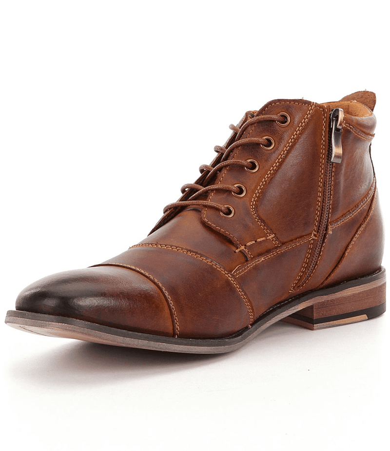 Steve Madden Jabbar boots in brown leather with cap-toe design, lace-up front, side zipper, and low stacked heel, angled front view.