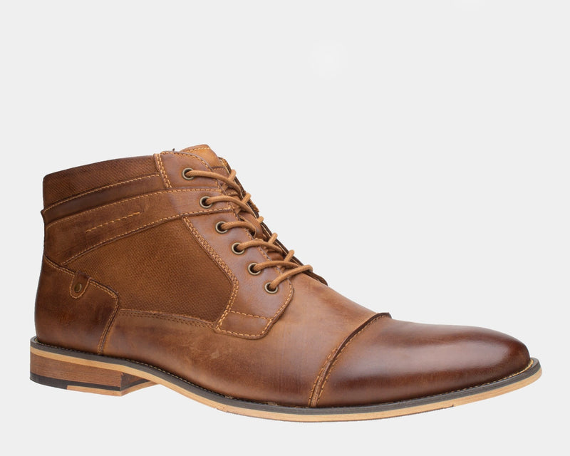 Steve Madden Jotter men's ankle boots in brown leather with cap-toe design, lace-up closure, and lightly textured finish, side view.