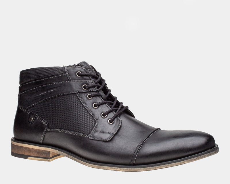 Steve Madden Jotter boots in black with textured paneling, leather upper, lace-up design, and wooden sole, side view.