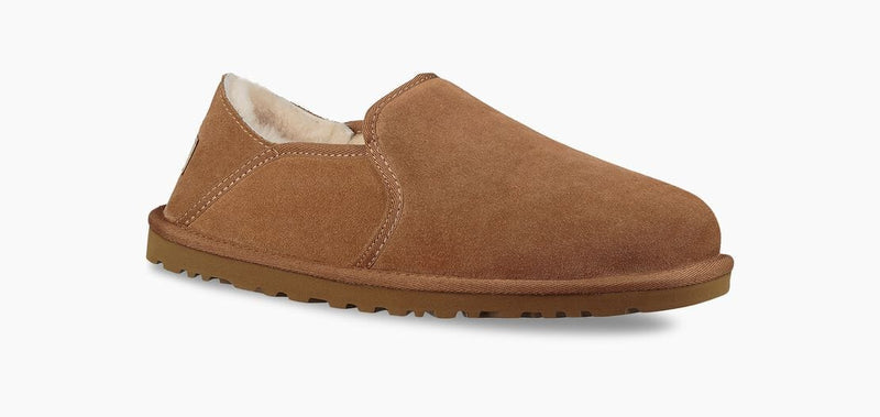 UGG Kenton slippers in chestnut brown suede with plush shearling lining and durable rubber outsole, side angle view.