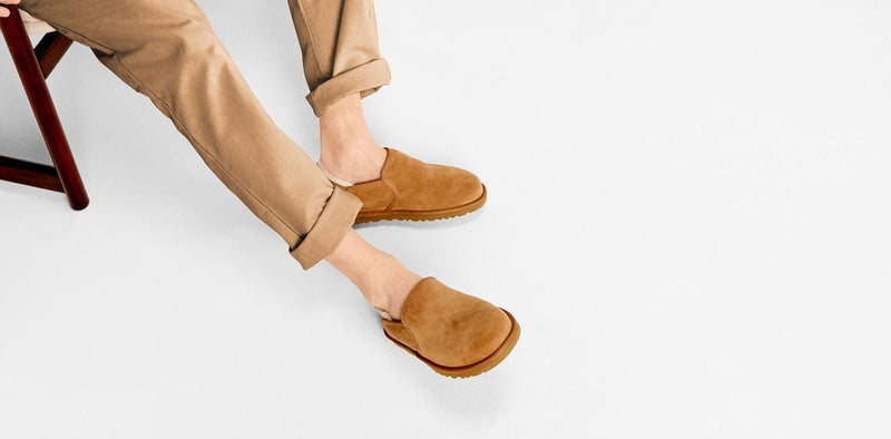 UGG Kenton slippers in chestnut suede with a slip-on design and soft lining, lifestyle view showcasing relaxed fit.