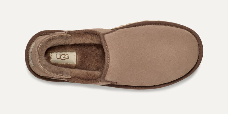 UGG Kenton slippers in tan suede with plush shearling lining, top view showing slip-on design and logo detail.