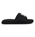 The Kids' Bolsa Slides by DC Shoes feature a black design with a thick strap showcasing white lettering, plus a textured, cushioned footbed for all-day comfort—stylish and easy slides perfect for kids.