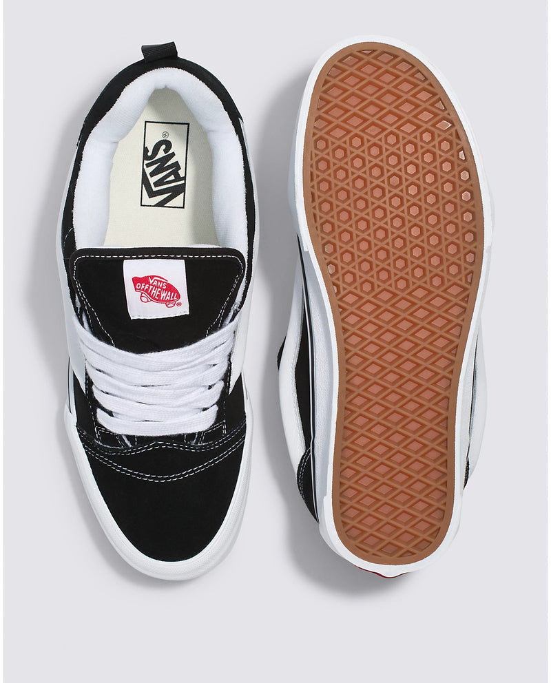 Vans Knu Skool Core skate shoes in black and white with suede upper, white stitching, and waffle outsole, top and sole view.