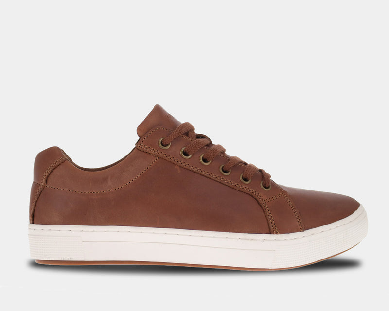 Propét Koda casual shoes in brown leather with metal eyelets and a white rubber outsole, side view.