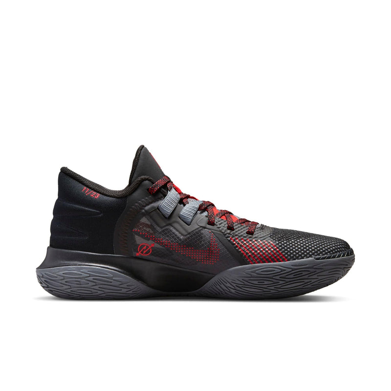 Nike Kyrie Flytrap V basketball shoes in black with red accents, mesh upper, and textured outsole, side view.