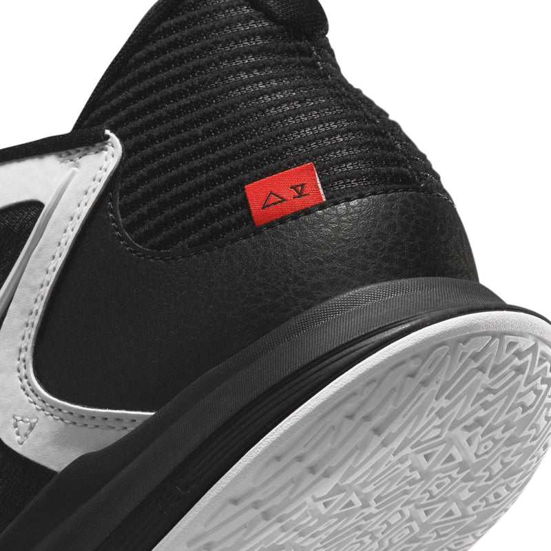 Nike Kyrie Low 5 basketball shoes, back corner detailing in black and white with textured sole and red logo accents.