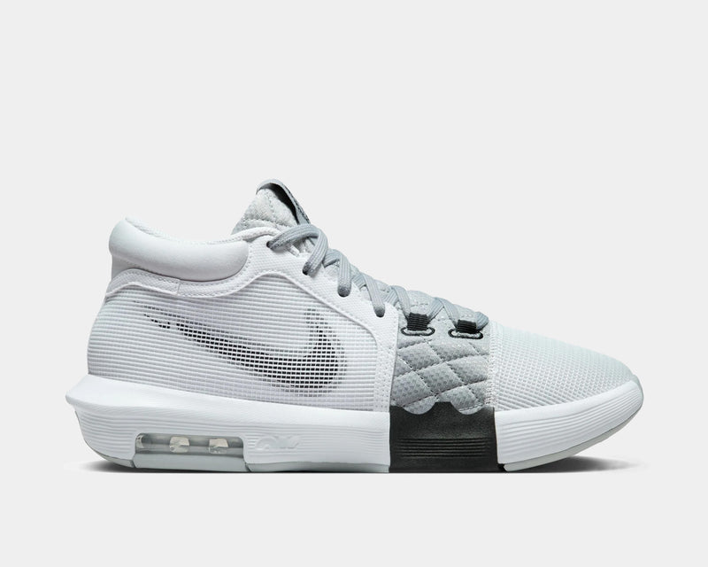 Nike LeBron Witness 8 basketball shoes in white and gray with mesh upper, quilted midfoot, and visible Air unit, side view.