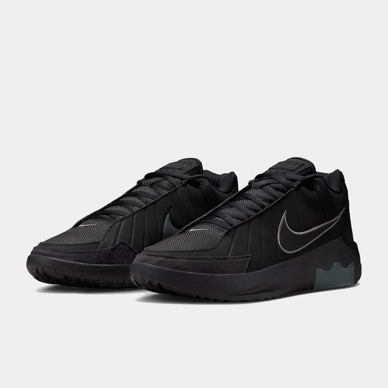 Nike LeBron Witness IX basketball shoes in black with mesh uppers, reinforced toe, and signature Swoosh logo, angled front view.