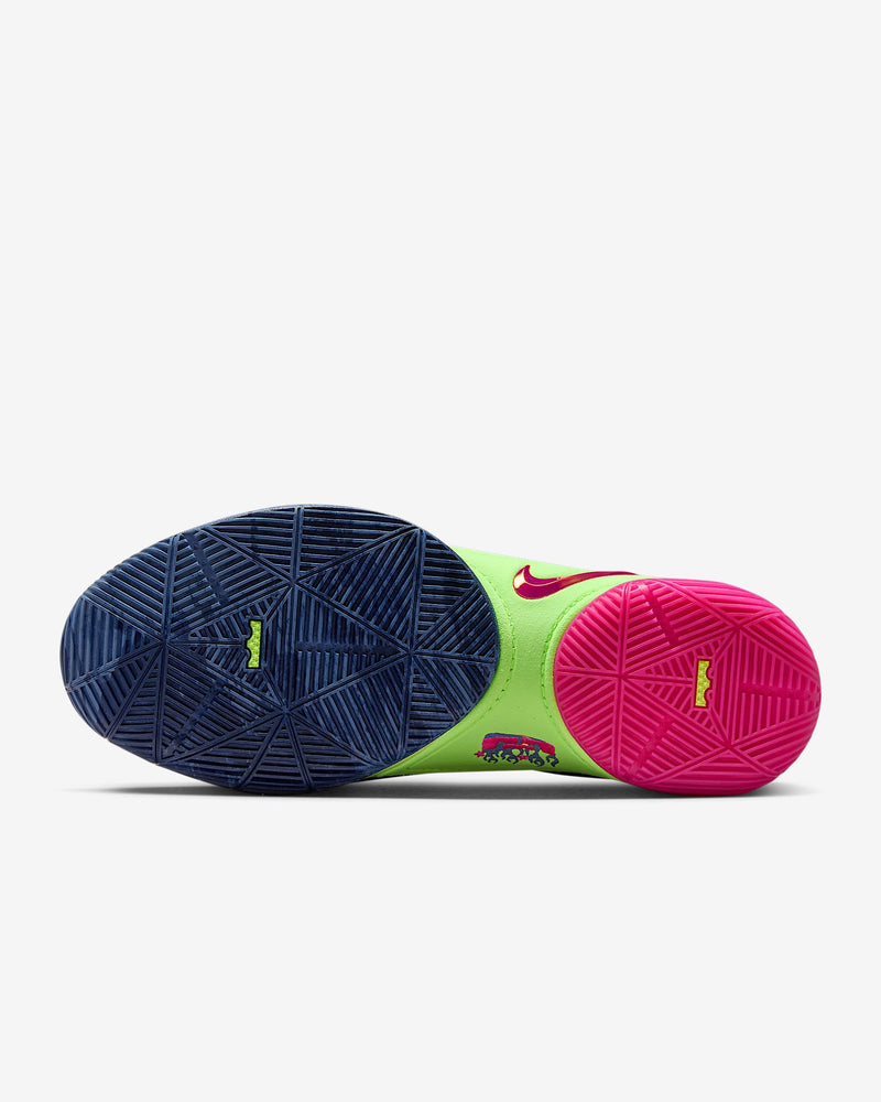 Nike LeBron XXII "Bryce's World" basketball shoes outsole with textured traction in blue and pink, featuring green midsole accents.