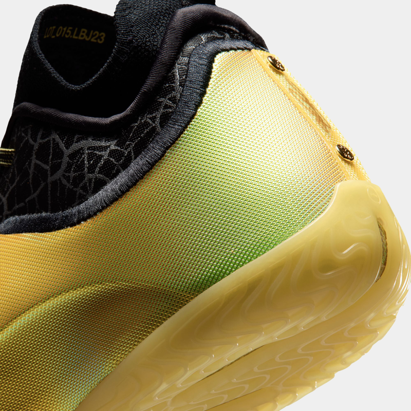 Nike LeBron XXIII Elite "Hurt Feelings" basketball shoes, close-up of yellow and green textured heel with black collar and translucent outsole detailing.