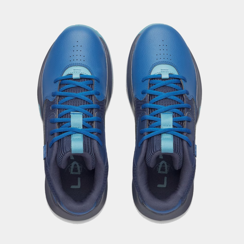 Under Armour Lockdown 7 basketball shoes in blue with perforated toe box and lace-up design, top view.