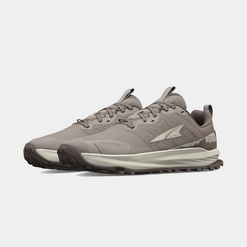 Altra Lone Peak 9 GTX trail running shoes in taupe with Gore-Tex upper, durable outsole, and cushioning midsole, angled side view.