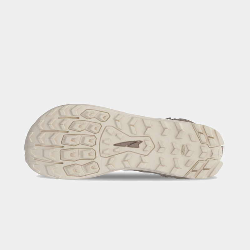 Altra Lone Peak 9 Waterproof Mid hiking boots outsole in beige with rugged tread pattern for grip and durability.