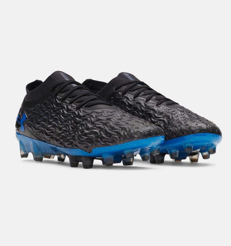 Under Armour Magnetico Elite 5 FG soccer cleats in black and bright blue with textured upper and molded studs, angled front view